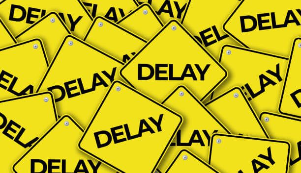Many yellow warning signs that say delay