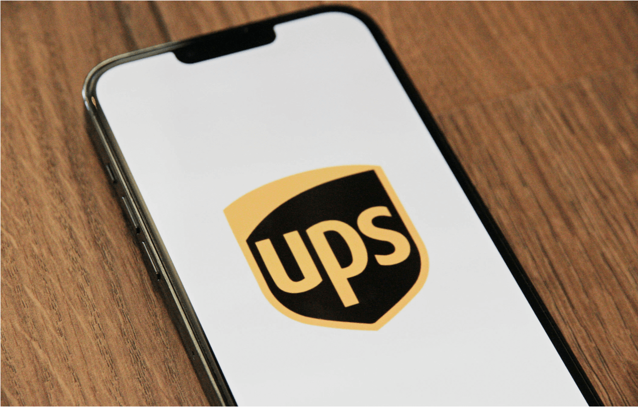 The UPS logo is displayed on the mobile phone